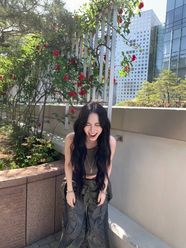 Karina, unique visual with black hair and khaki sleeveless top... aespa announces 2nd album release on the 29th