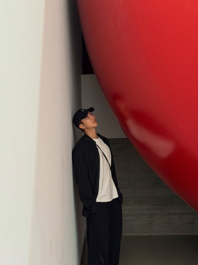 BTS RM wearing a cat ear hat and taking a selfie Its an emotional autobahn