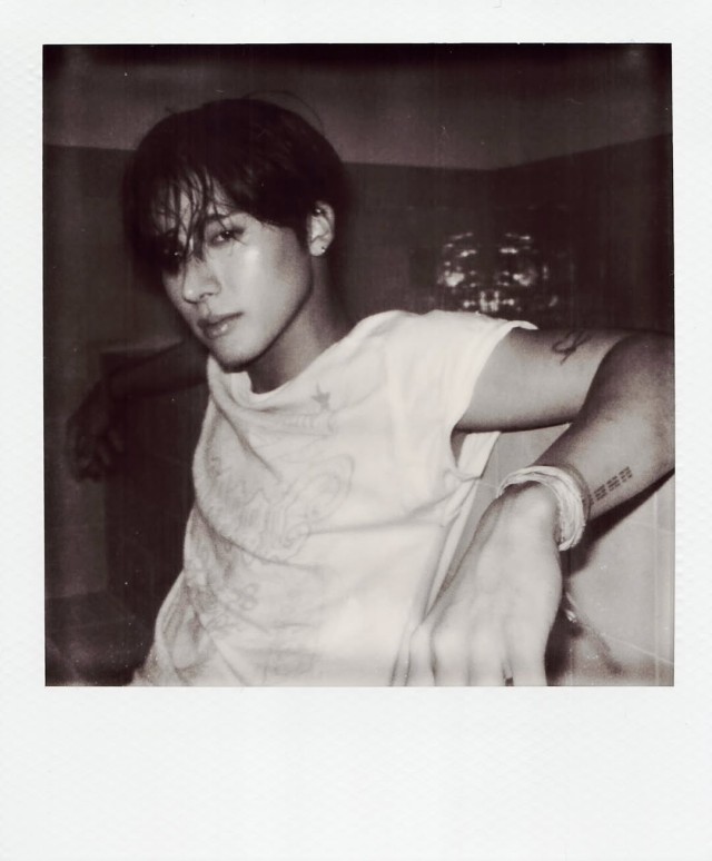 Eric, wearing a white T-shirt and a brown hat, enjoying a relaxed day... 